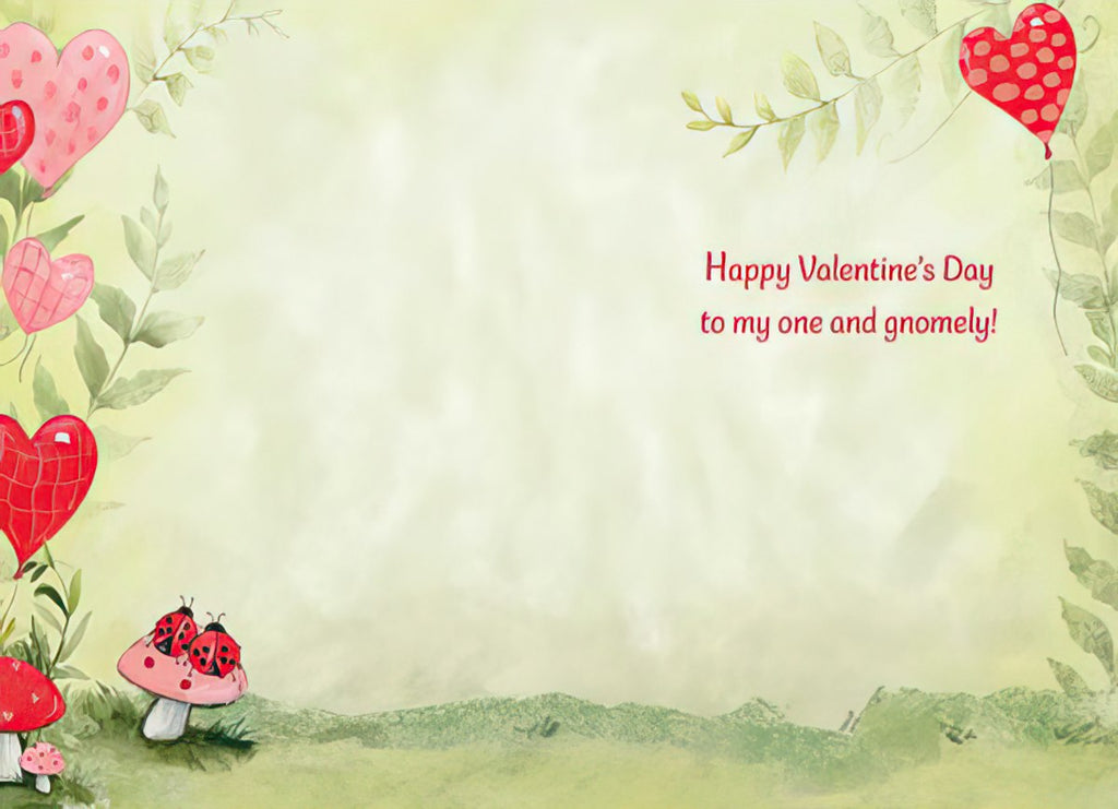 Inside of a cute Valentine's greeting card, featuring a light green and pink whimsical background with floating hearts, green leaves, and red mushrooms. Pre-printed text says: 'Happy Valentine's Day to my one and gnomely!'