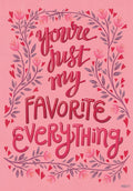 Romantic pink greeting card featuring ornate script 'You're just my favorite everything' encircled by a delicate floral and heart border for Valentine's Day.
