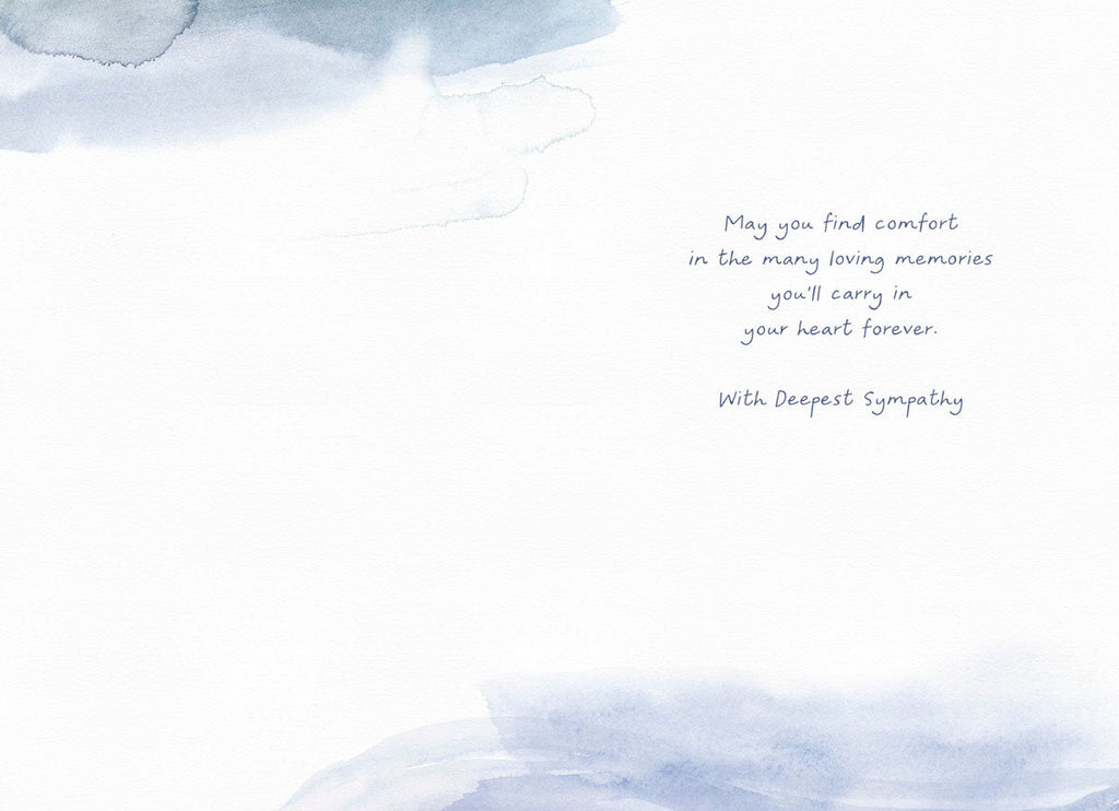Inside of a thoughtful bereavement card showing a light blue watercolor background with the comforting message 'May you find comfort in the many loving memories you'll carry in your heart forever. With Deepest Sympathy' on the right.