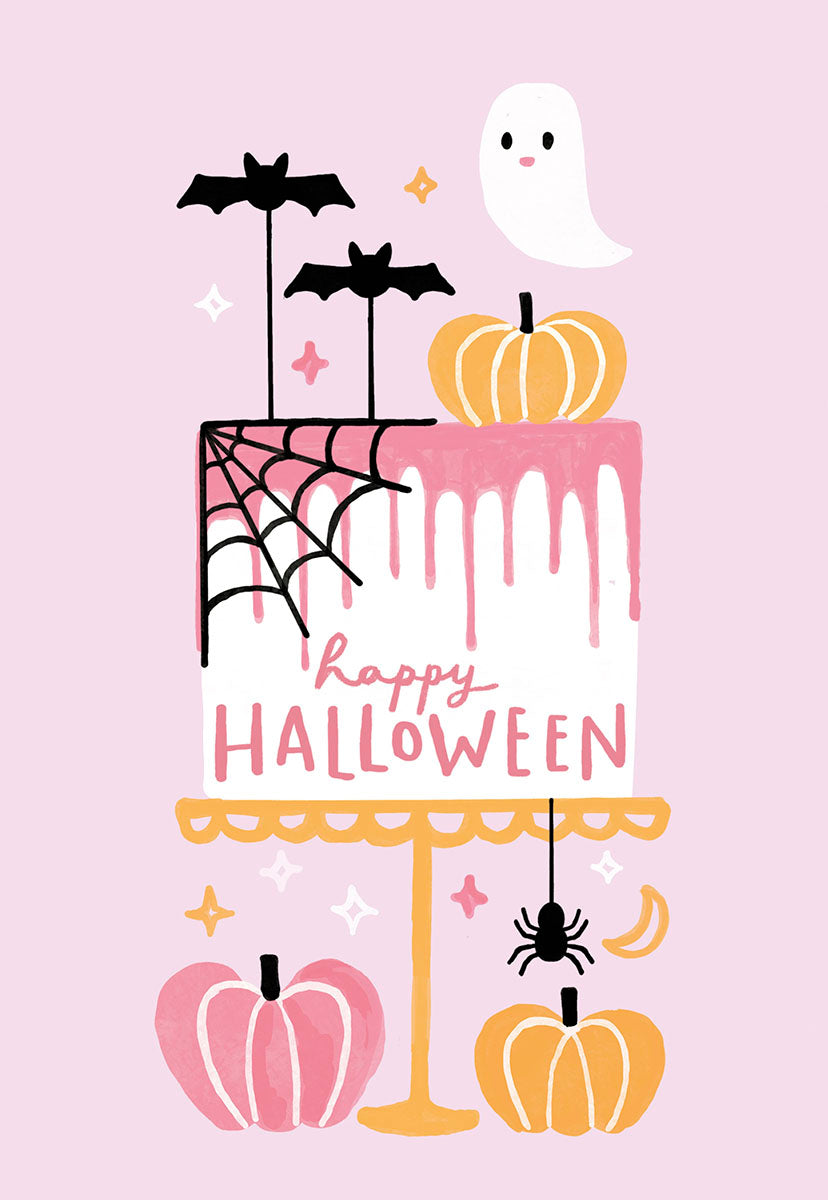 Cute pastel pink Halloween greeting card featuring a decorated cake with a friendly ghost, bats, spiderweb, spider, and pink and orange pumpkins. The cake reads "Happy Halloween".