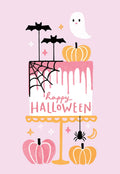 Cute pastel pink Halloween greeting card featuring a decorated cake with a friendly ghost, bats, spiderweb, spider, and pink and orange pumpkins. The cake reads "Happy Halloween".