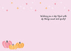 Inside of a pastel pink Halloween greeting card featuring sparkling star accents and a small cluster of pink and orange pumpkins at the bottom. Handwritten text reads: 'Wishing you a day filled with all things sweet and spooky!'.