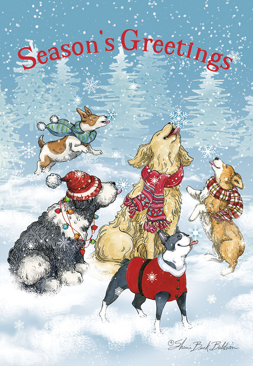 Front of a 'Season's Greetings' card showing five adorable dogs in winter hats and scarves, catching snowflakes in a snowy forest.