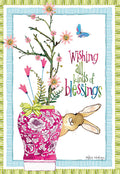 Front of a cheerful spring greeting card featuring a decorative pink vase with blooming flowers, a blue butterfly, and a curious brown bunny peeking from behind. Text reads 'Wishing all kinds of blessings' on a white background with a striped border.