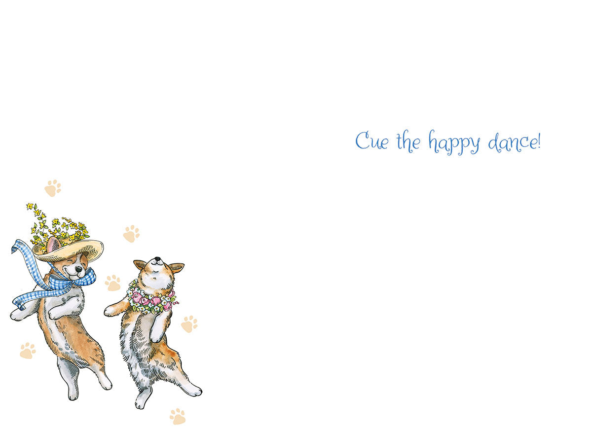 Interior of a joyful spring occasion card with two dancing corgi dogs on the bottom left corner, mirroring the front design, and the message 'Cue the happy dance!' in blue script on the right side.
