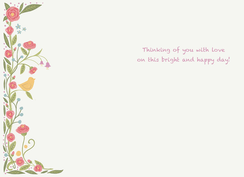Interior of an elegant holiday card, showcasing a border of pink flowers, green foliage, and a yellow bird, with a printed message: 'Thinking of you with love on this bright and happy day!'