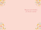 Inside view of a religious greeting card with the message 'May your joy be boundless, for His love is eternal!' in elegant script, framed by delicate spring floral designs in the corners on a pale pink background.