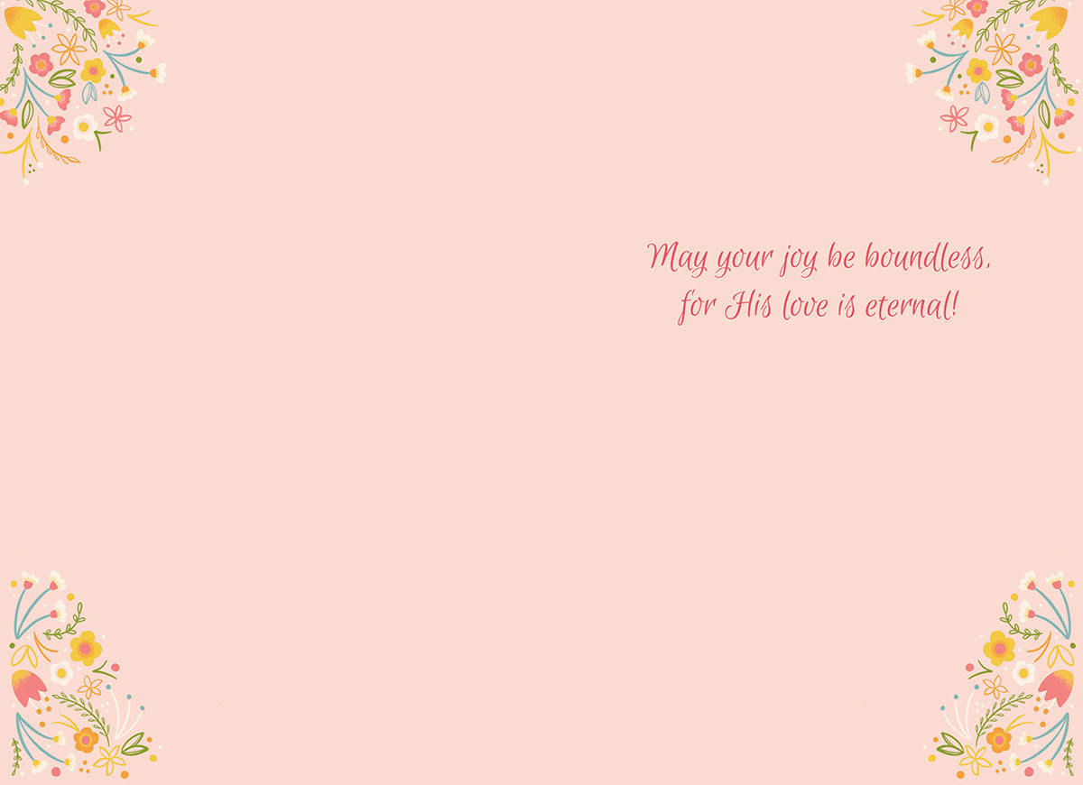 Inside view of a religious greeting card with the message 'May your joy be boundless, for His love is eternal!' in elegant script, framed by delicate spring floral designs in the corners on a pale pink background.