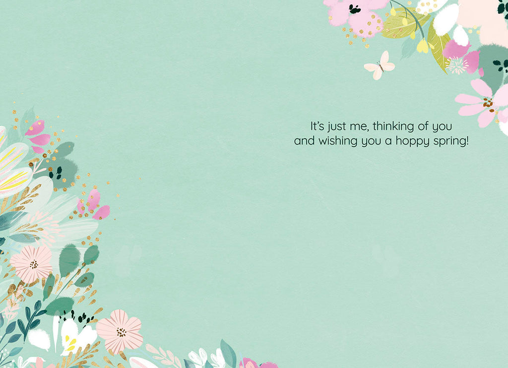 Inside of a sweet Easter card, revealing the message 'It's just me, thinking of you and wishing you a hoppy spring!' surrounded by soft floral designs on a light green background.