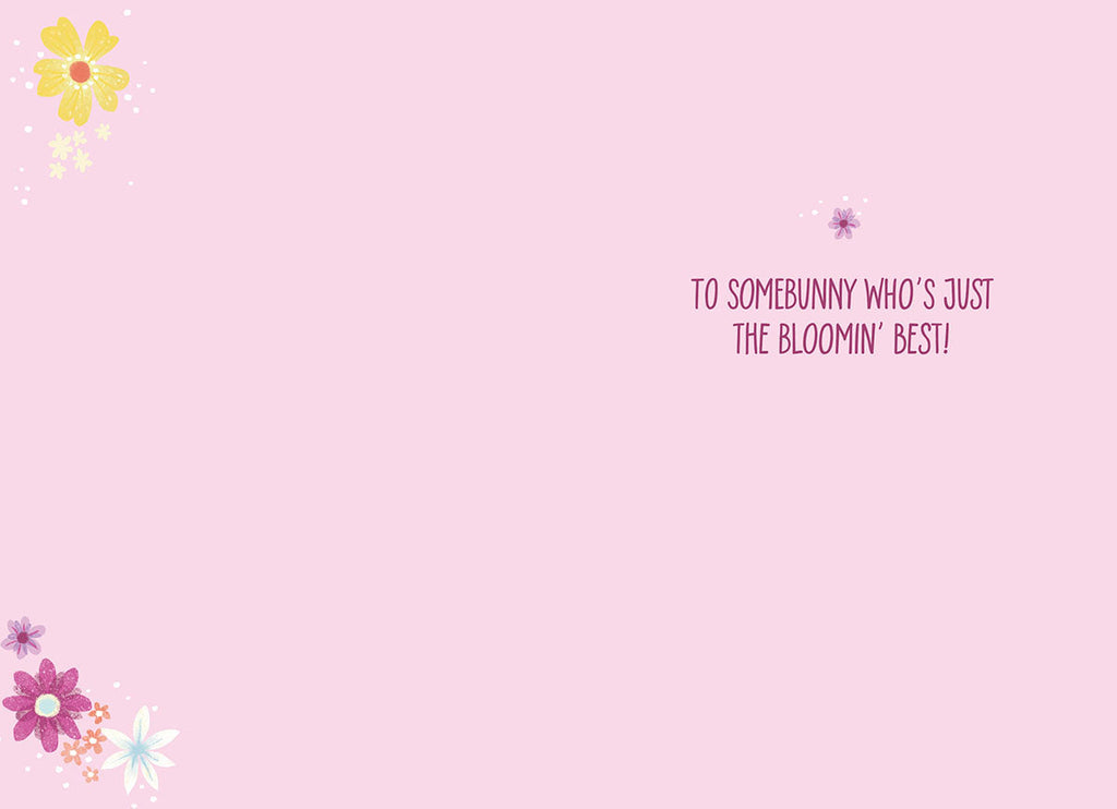 Inside of a cute Easter card displaying a heartfelt message 'TO SOMEBUNNY WHO'S JUST THE BLOOMIN' BEST!' on a gentle pink background with delicate floral accents.