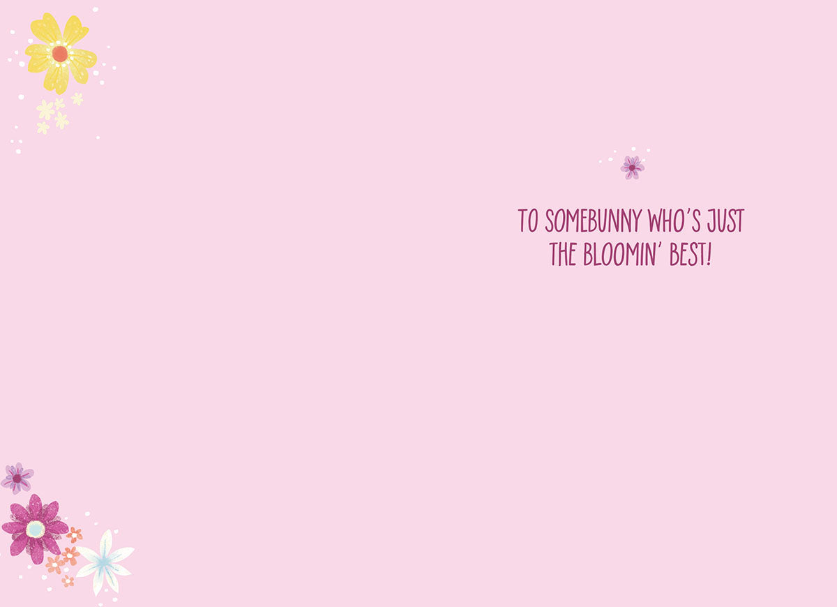 Inside of a cute Easter card displaying a heartfelt message 'TO SOMEBUNNY WHO'S JUST THE BLOOMIN' BEST!' on a gentle pink background with delicate floral accents.