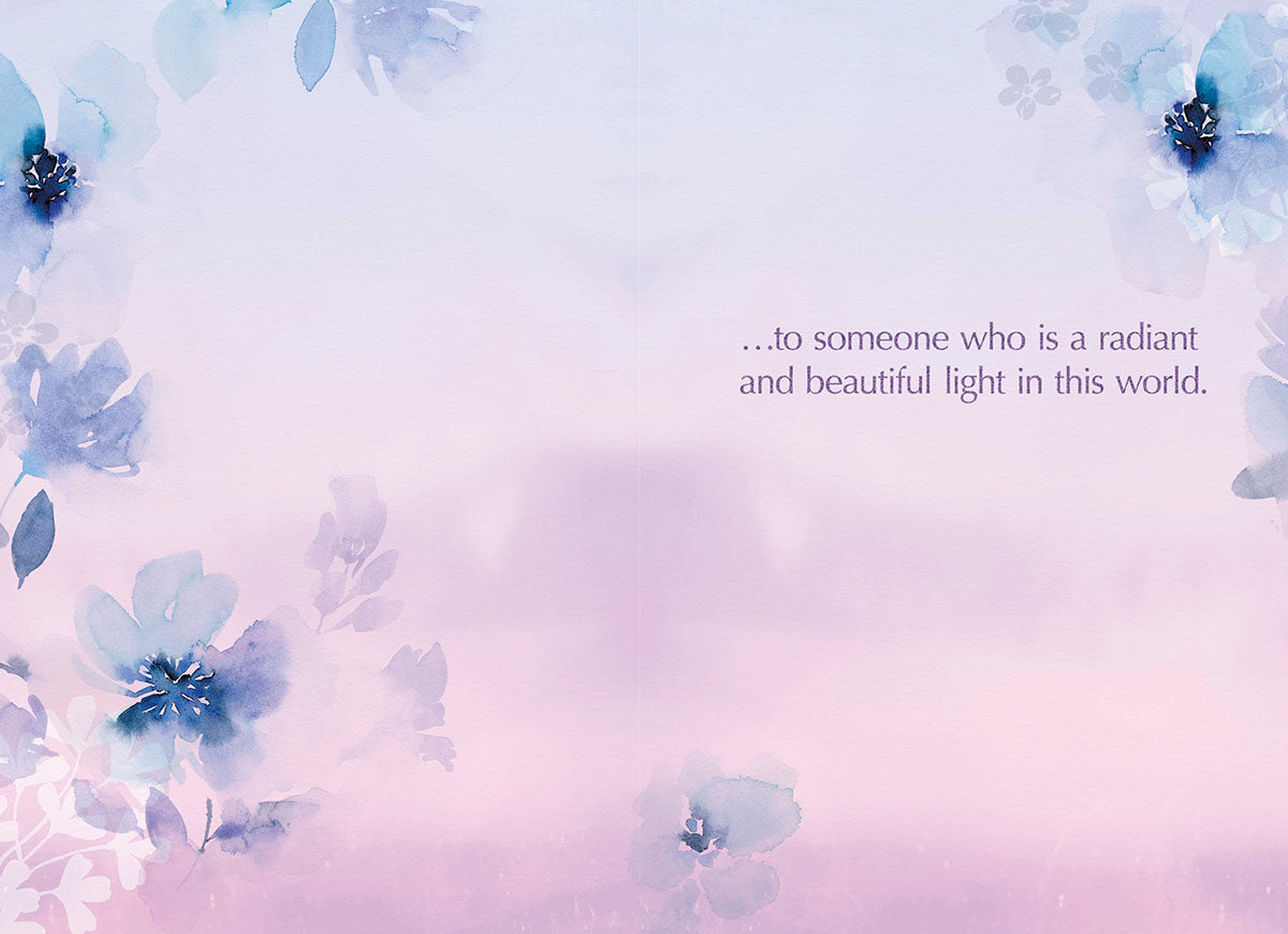 Inside of a Mother's Day greeting card with text '...to someone who is a radiant and beautiful light in this world.', surrounded by delicate purple and blue watercolor floral illustrations, offering a heartfelt message for a special mom.