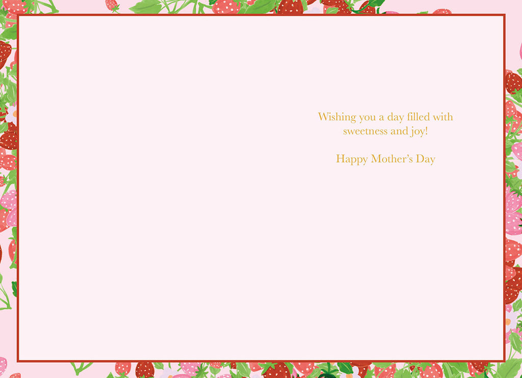 Inside of a Mother's Day greeting card with a light pink background, bordered by a strawberry and leaf pattern, featuring the golden text 'Wishing you a day filled with sweetness and joy! Happy Mother's Day'.