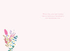 Inside of a Mother's Day greeting card with a small bouquet of wildflowers in the bottom left corner and heartfelt wishes on the right: 'With love and best wishes for an especially wonderful and memorable day.'