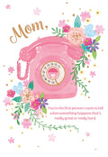Front of a Mother's Day greeting card featuring a pink vintage rotary telephone, surrounded by colorful watercolor flowers in pink, blue, purple, and yellow. The text "Mom," is written above the phone, and below it reads: "You're the first person I want to tell when something happens that's really great or really hard."