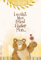 Front of a Mother's Day greeting card featuring a cute brown teddy bear holding a red flower with a ladybug. The card has a textured yellow background and the text 'I couldn't have picked a better Mom...'.