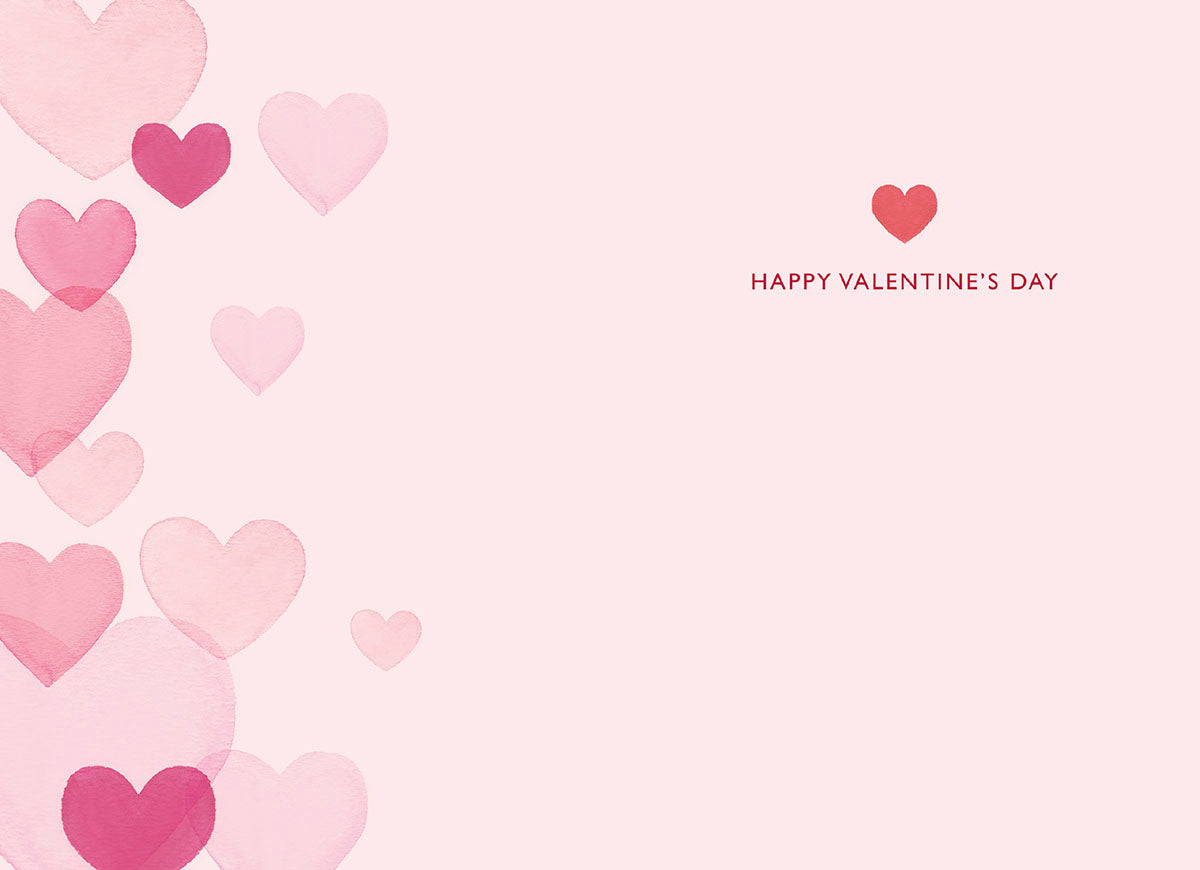 Inside of a Valentine's Day greeting card showing a blank pink surface for a personalized message, bordered on the left by soft watercolor hearts, with 'HAPPY VALENTINE'S DAY' and a small red heart on the right.