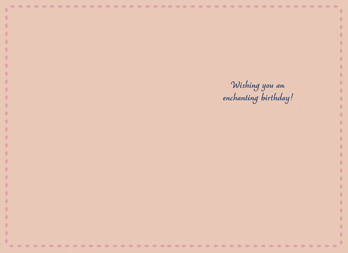 Inside of a magical celestial greeting card, light pink background with a dotted border, showing the printed message 'Wishing you an enchanting birthday!' in elegant script.