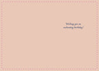 Inside of a mystical birthday card with a light pink background, subtle dotted border, and 'Wishing you an enchanting birthday!' in elegant script.