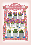 Front of a vibrant, folk art inspired thank you greeting card. The card features a tiered display of potted colorful flowers including tulips, ranunculus, and hyacinths, with 'Thanks a Bunch' written at the top. Ideal for expressing gratitude with a cheerful floral design.