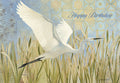 Elegant greeting card featuring a majestic white egret soaring over green marsh reeds with intricate blue and gold patterned background. 'Happy Birthday' is written in elegant script on the front.