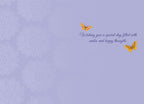 Inside of a cute birthday greeting card with a light lavender purple background featuring subtle mandala patterns. Two yellow butterflies flutter above elegant script text that reads: 'Wishing you a special day filled with smiles and hoppy thoughts.'