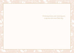 Inside of a heartfelt floral birthday card featuring a light pink patterned border and the message 'Thinking of you and wishing you a special and love-filled day.'