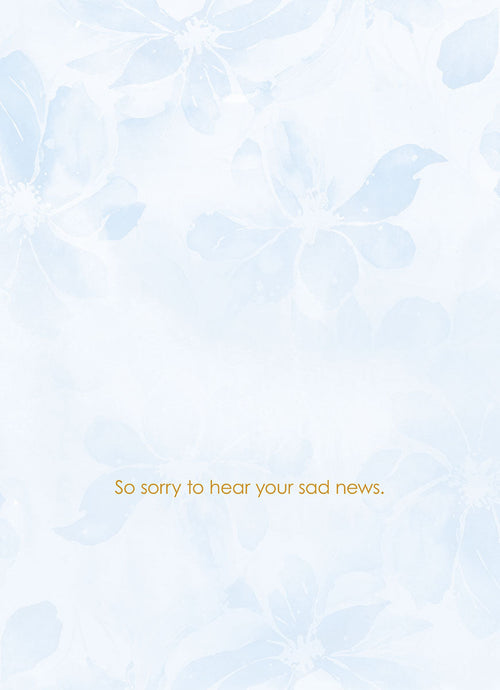 Inside view of an encouragement card with subtle blue floral watermark and gold text 'So sorry to hear your sad news.', offering heartfelt sympathy.