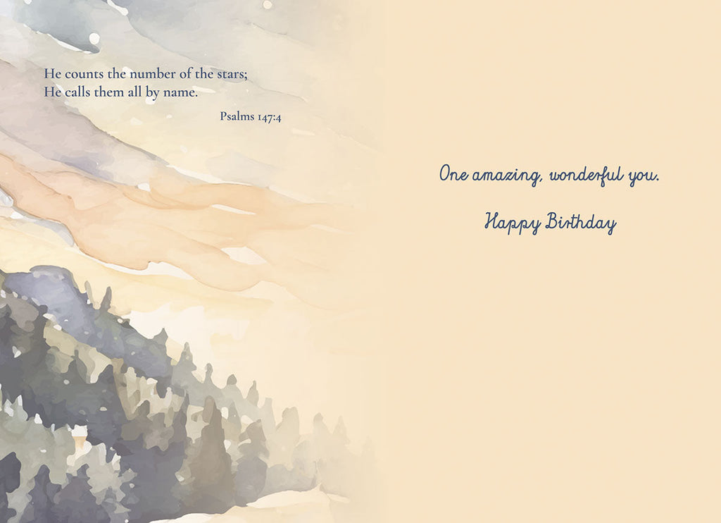 Inside view of a religious birthday card, showing a watercolor landscape of trees and a cloudy sky, with Psalm 147:4 'He counts the number of the stars; He calls them all by name.' and the message 'One amazing, wonderful you. Happy Birthday'.