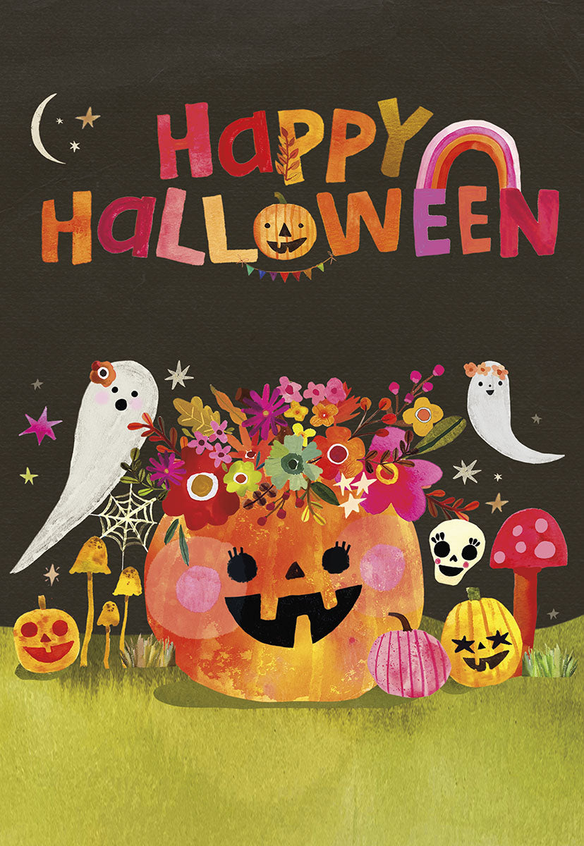 Front of a cute Halloween greeting card featuring a cheerful floral pumpkin overflowing with flowers, two friendly white ghosts, small jack-o'-lanterns, whimsical mushrooms, and stars on a dark background. The text 'Happy Halloween' is prominently displayed in colorful, playful letters with a rainbow.