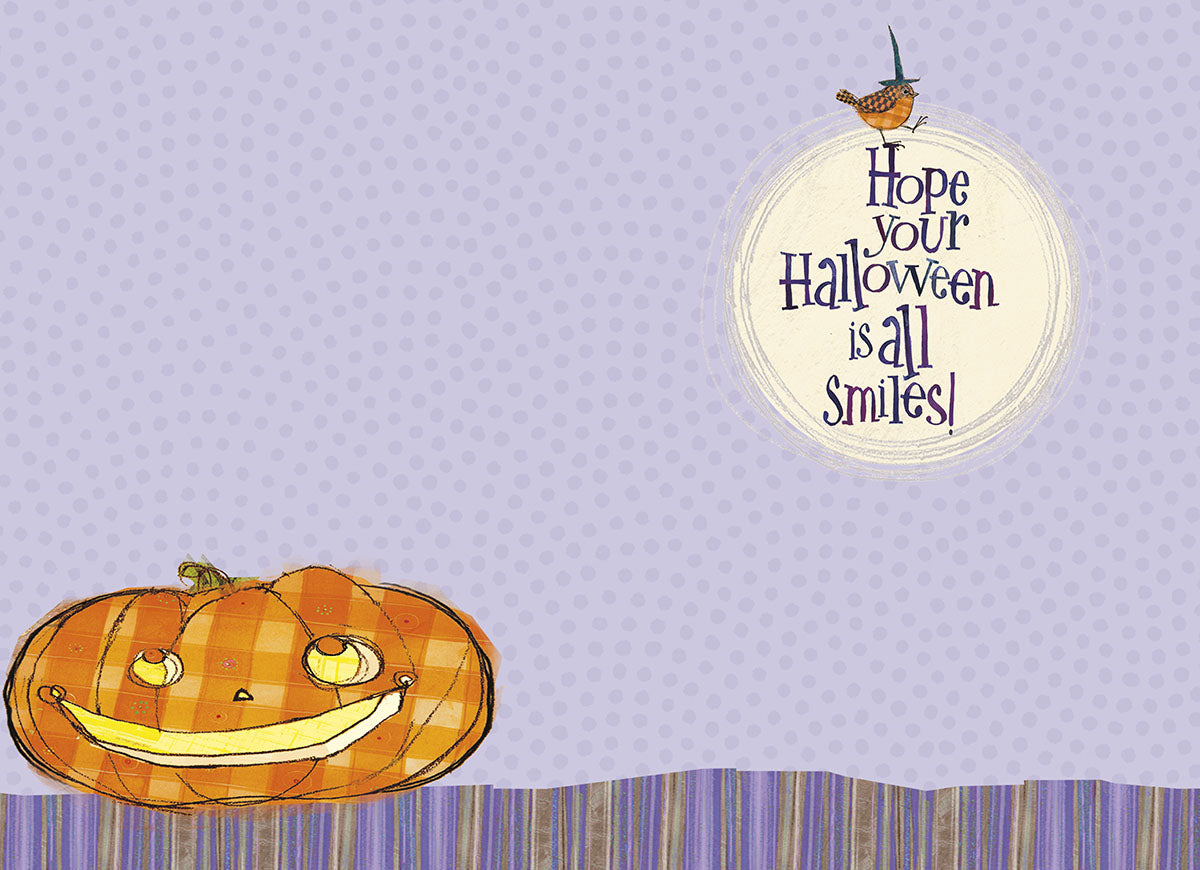 Inside of a cute Halloween greeting card for kids, showing a smiling pumpkin and the cheerful message: 'Hope your Halloween is all Smiles!' on a polka dot background.