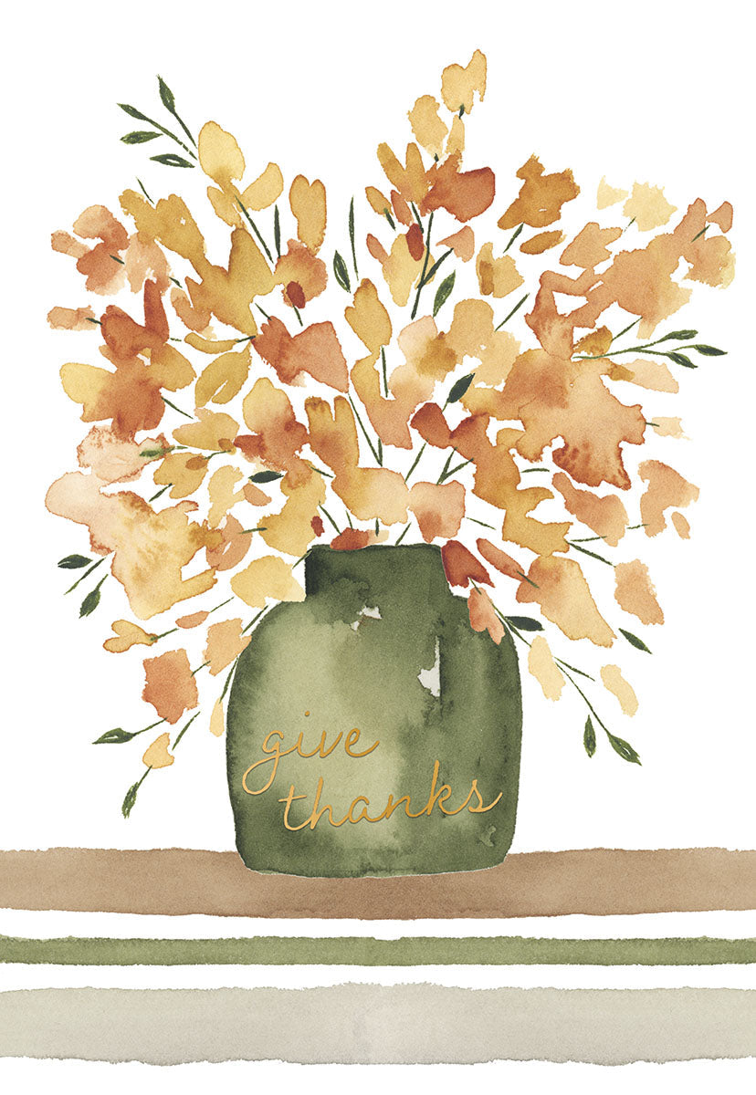 Front view of an elegant watercolor greeting card featuring a sage green vase with 'give thanks' in gold script, filled with vibrant orange and yellow autumn flowers and green foliage, on a white background with a horizontal striped base. Perfect for expressing gratitude.