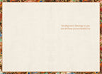 Inside of a warm autumn blessing card with a feather border, displaying the heartfelt message 'Sending warm blessings to you and all those you're thankful for' on a cream textured background.