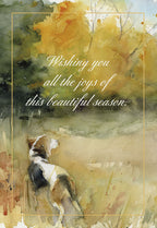 Watercolor greeting card featuring a beagle dog watching golden autumn foliage, with a warm seasonal message.