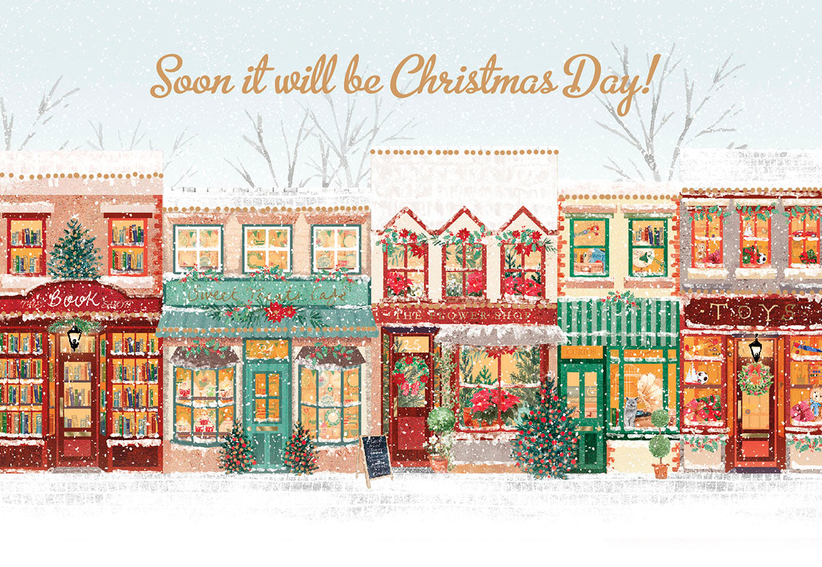Charming Christmas greeting card featuring a snowy street scene with a row of beautifully decorated shops and the text 'Soon it will be Christmas Day!'