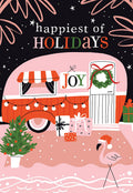 Front of a lighthearted holiday greeting card featuring a pink retro camper decorated with string lights, gifts, and a wreath. A cheerful flamingo wearing a Santa hat stands next to a mini Christmas tree. Text reads 'happiest of HOLIDAYS' against a dark, starry background. Unique holiday card design.