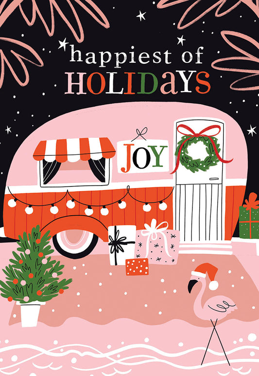 Front of a 'Happiest of HOLIDAYS' Christmas card with a pink camper, flamingo in Santa hat, Christmas tree, gifts, and string lights.