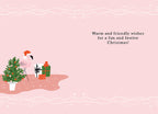 Inside a festive pink holiday greeting card with a whimsical flamingo in a Santa hat, a small decorated Christmas tree, and gifts. The text reads 'Warm and friendly wishes for a fun and festive Christmas!'.