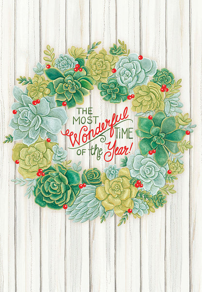 Front of a lighthearted succulent wreath holiday card on white wood background, "The Most Wonderful Time of the Year!".
