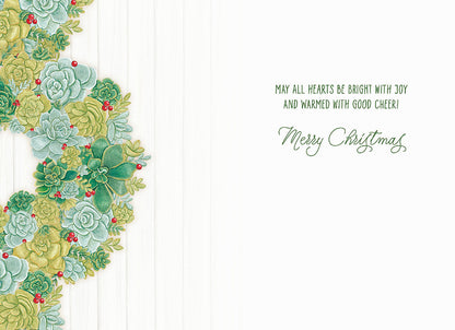 Inside of a holiday card with a partial succulent wreath design, "May all hearts be bright with joy and warmed with good cheer! Merry Christmas".