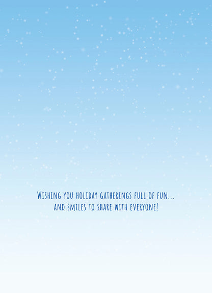 Inside of a holiday greeting card with a light blue snowy background and message 'WISHING YOU HOLIDAY GATHERINGS FULL OF FUN...'