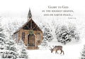 Winter wonderland greeting card showing a snow-covered wooden chapel with a wreath, evergreen trees, and a lone reindeer standing in the snow. Features the Bible verse Luke 2:14 'Glory to God in the highest heaven, and on earth peace.' on the front.
