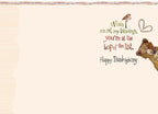 Inside view of a Thanksgiving greeting card showing warm sentiment: 'When I count my blessings, you're at the top of the list. Happy Thanksgiving.' A glimpse of the cute bear illustration is visible, adding to the charm.
