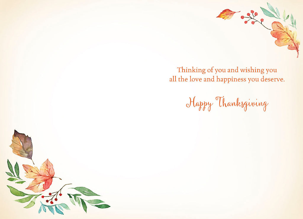 Inside of an autumnal watercolor greeting card displaying warm message 'Thinking of you and wishing you all the love and happiness you deserve. Happy Thanksgiving' with corner leaf accents.