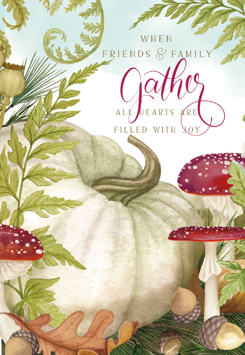 Front of a watercolor Thanksgiving card featuring a large white pumpkin, red toadstools, acorns, and green fern leaves. Script reads 'When friends & family gather, all hearts are filled with joy.' Perfect for autumn greetings.