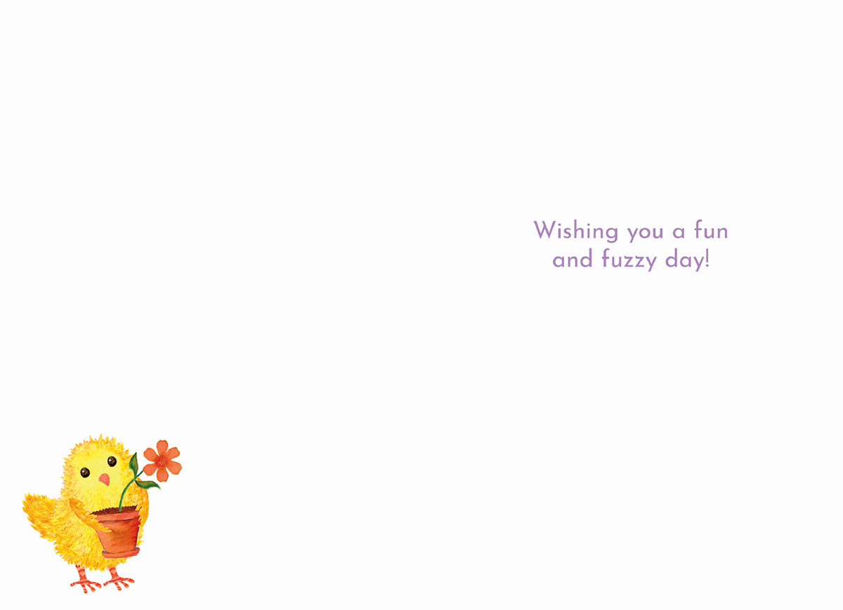 Inside view of a fun and fuzzy Easter card, revealing a small yellow chick holding a potted orange flower and the heartwarming message 'Wishing you a fun and fuzzy day!' on a light purple background.