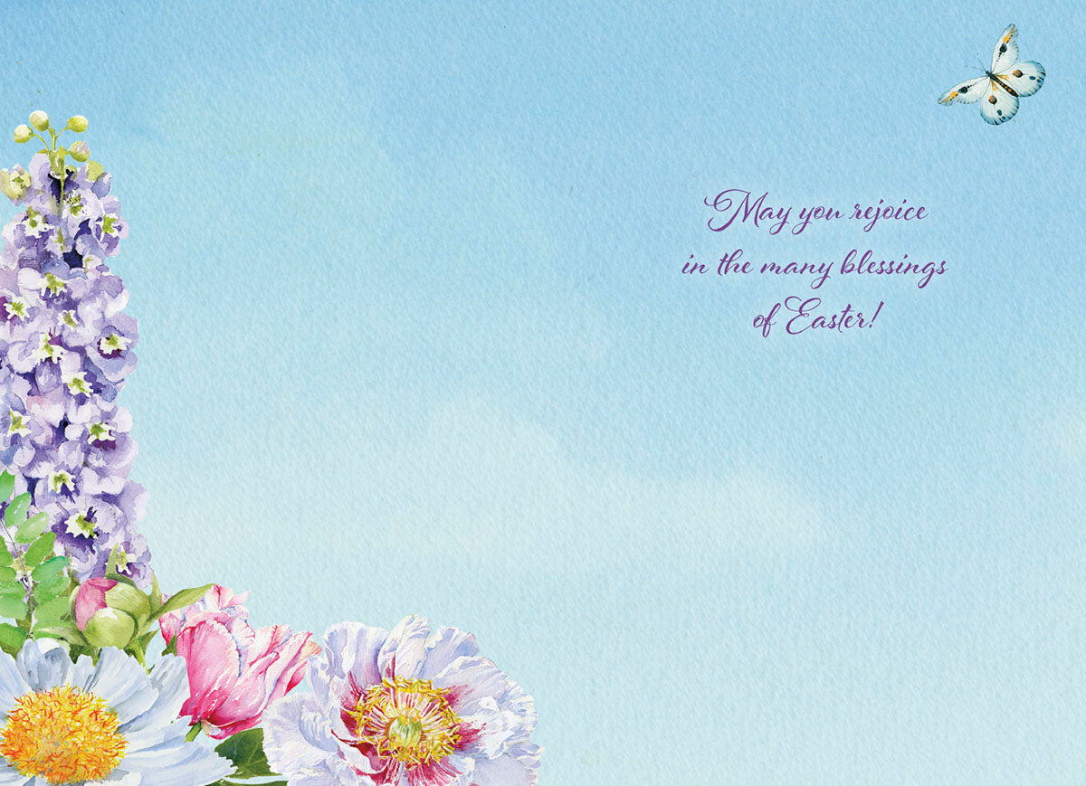 Inside of religious Easter card with 'May you rejoice in the many blessings of Easter!', surrounded by watercolor flowers.