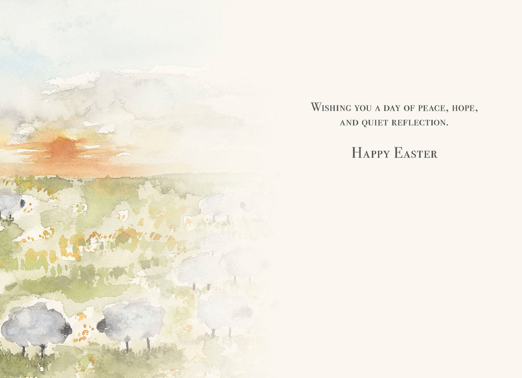 Inside a religious greeting card for a spring occasion, showing a peaceful watercolor field with sheep and the message 'Wishing you a day of peace, hope, and quiet reflection. Happy Easter', ideal for a loved one.