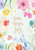 Front of an Easter greeting card featuring watercolor pastel flowers (pink, yellow, blue, purple, orange, green) framing a light green background with the handwritten text 'Love Hope Joy'.