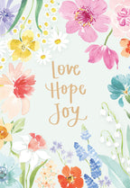 Front of an Easter greeting card featuring watercolor pastel flowers (pink, yellow, blue, purple, orange, green) framing a light green background with the handwritten text 'Love Hope Joy'.
